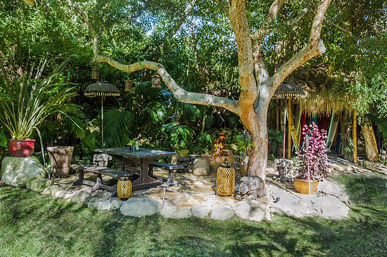 Entertain in this shady oasis with firepit